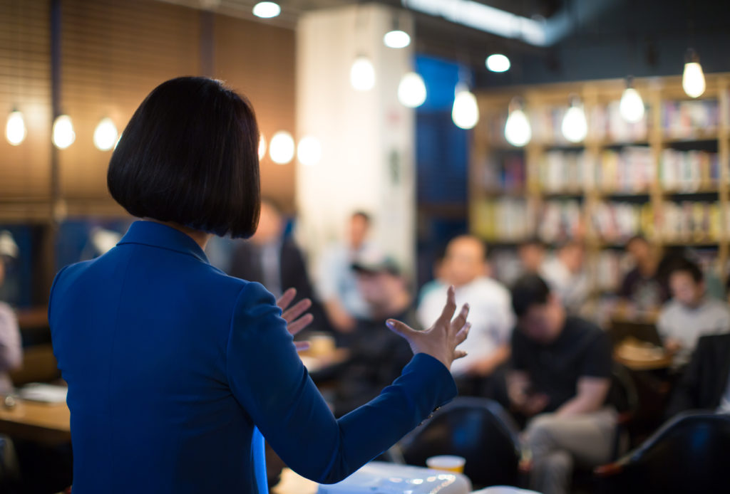 woman handling questions during a presentation