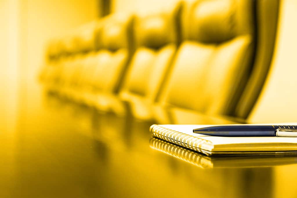 pad and pen on table in boardroom ready for senior management presentation