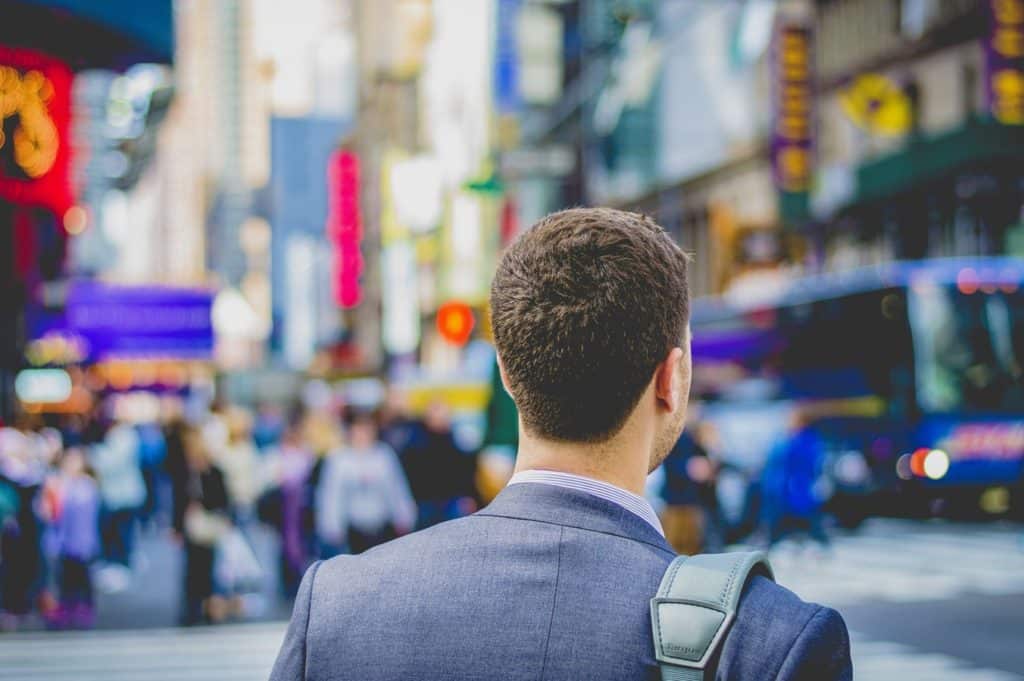 Businessman feeling alone after a presentation is a symptom of cognitive bias in communication