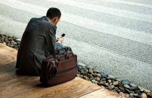 man sitting on street