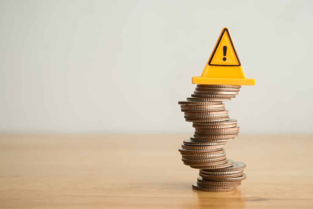 Warning,Sign,Label,On,Stack,Coins,In,Uncertainty,Situation,